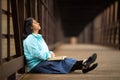 Hispanic Woman Sitting And Meditating Bible On A Bridge Royalty Free Stock Photo