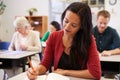 Hispanic woman studying at an adult education class Royalty Free Stock Photo
