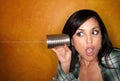 Hispanic woman with tin can telephone Royalty Free Stock Photo