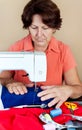 Hispanic woman working on a sewing machine