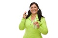 Hispanic Woman In Workout Clothes with Music Player and Headphones