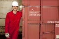 Hispanic worker opening industrial railway carriage