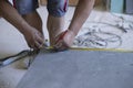 Hispanic worker with ruler and pencil making signals