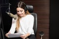 Radio host broadcasting a show in studio