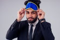 Hispanic young handsome black hair man in stylish business suit sleeping in studio isolate white background