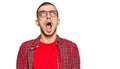 Hispanic young man wearing casual clothes angry and mad screaming frustrated and furious, shouting with anger Royalty Free Stock Photo