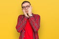 Hispanic young man wearing casual clothes tired hands covering face, depression and sadness, upset and irritated for problem Royalty Free Stock Photo