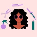 Hispanik Latino American women. There are hairdressing tools hair spray,scissors,comb,curling iron around her head. Pink