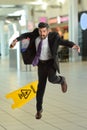 Hispanoc Businessman Falling on Wet Floor Royalty Free Stock Photo