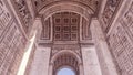 Historic Arc de Triomphe in Paris, France on a sunny day.