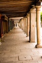 Historic arcade in the center of HalcalÃÂ¡ with stone columns and wooden ceiling