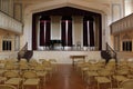 Rows of metal seats arranged to face podium in meeting room, Oneida Community Mansion House, New York, 2018 Royalty Free Stock Photo