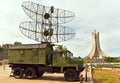 Historic army vehicle with antenna and in the background of the Martyrs\' Memorial, Maqam Echahid, Algiers, Algeria