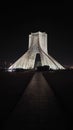 Historic Azadi Tower in Baghdad, Iraq, illuminated against the night sky Royalty Free Stock Photo