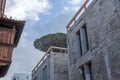 Historic balcony, modern building in shell and dragon tree in Tenerife Royalty Free Stock Photo