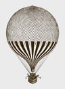 Historic balloon with several passengers standing in the basket