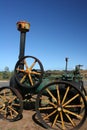 Historic black and green rusty Steam Engine Tractor