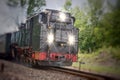 Historic steam powered railway train with lights Royalty Free Stock Photo