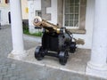 Historic brass cannon on city street Royalty Free Stock Photo