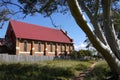 Australia: old brick church with gum tree - h