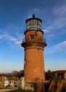 Historic brick lighthouse against blue sky Royalty Free Stock Photo