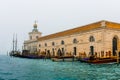 Historic building and a big Sailing boat at venice docks photo taken from `vaporetto Royalty Free Stock Photo