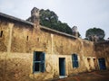 Historic Building with Blue Shutters Under Cloudy Sky Royalty Free Stock Photo