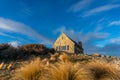 Historic building of church of Good Shepherd with dry tussock grass Royalty Free Stock Photo