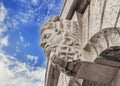 Historic building detail man head with blue cloudy sky Royalty Free Stock Photo