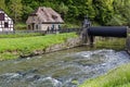 Historic building of former water mill at river Franconian Saale, Germany