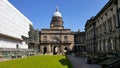 Historic building with lawn and clear blue sky in the background Royalty Free Stock Photo