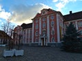 Historic building Neues Schloss with pink painted facade at empty square Schlossplatz in on sunny day.