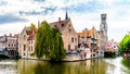 Historic buildings and the Belfort Tower viewed from the Dijver Canal in the medieval city of Bruges, Belgium Royalty Free Stock Photo