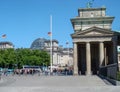 Historic buildings in Berlin: side view of Brandenburg Gate, with Bundestag German federal parliament in background