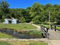 1800 Historic Buildings and a Foot Bridge over the creek in Spring Mill State Park Royalty Free Stock Photo