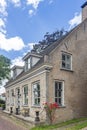 Historic buildings on the Herengracht in the picturesque village Drimmelen, Netherlands Royalty Free Stock Photo