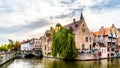 Historic buildings and a stone bridge over the Dijver Canal in the medieval city of Bruges, Belgium Royalty Free Stock Photo