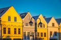 Historic burgher houses on the square lit by the morning sun