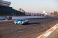 A classic racing car races around Kyalami race track