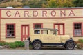 The historic Cardrona Hotel, Otago, New Zealand, with vintage car Royalty Free Stock Photo