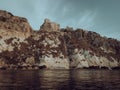 Historic castle ruins on a cliff over water at the Tremiti Islands in Puglia, Italy Royalty Free Stock Photo