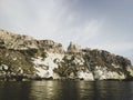 Historic castle ruins on a cliff over water at the Tremiti Islands in Puglia, Italy Royalty Free Stock Photo