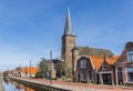 Historic catholic church at the canal in Balk Royalty Free Stock Photo