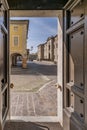 The historic center of Soragna, Parma, Italy, framed in the church door