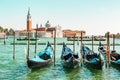 Historic center of Venice is waiting for tourists against the backdrop of gondolas. Sea view from Piazza San Marco in Venice, with Royalty Free Stock Photo