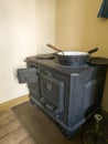 Historic Charm: An 1887 Wood Stove with Pots and Pans in an Old Copenhagen Apartment Royalty Free Stock Photo