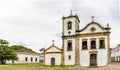 Historic church facade and surrounding houses in the ancient city of Paraty Royalty Free Stock Photo