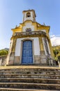 Historic church with its stairs, bell and tower in the city of Ouro Preto