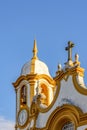 Historic church tower with bell and clock in the famous city of Tiradentes Royalty Free Stock Photo