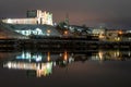 Historic city center at night in the light of night lighting. Night photo of the city. Reflection of houses in the river. Multi-